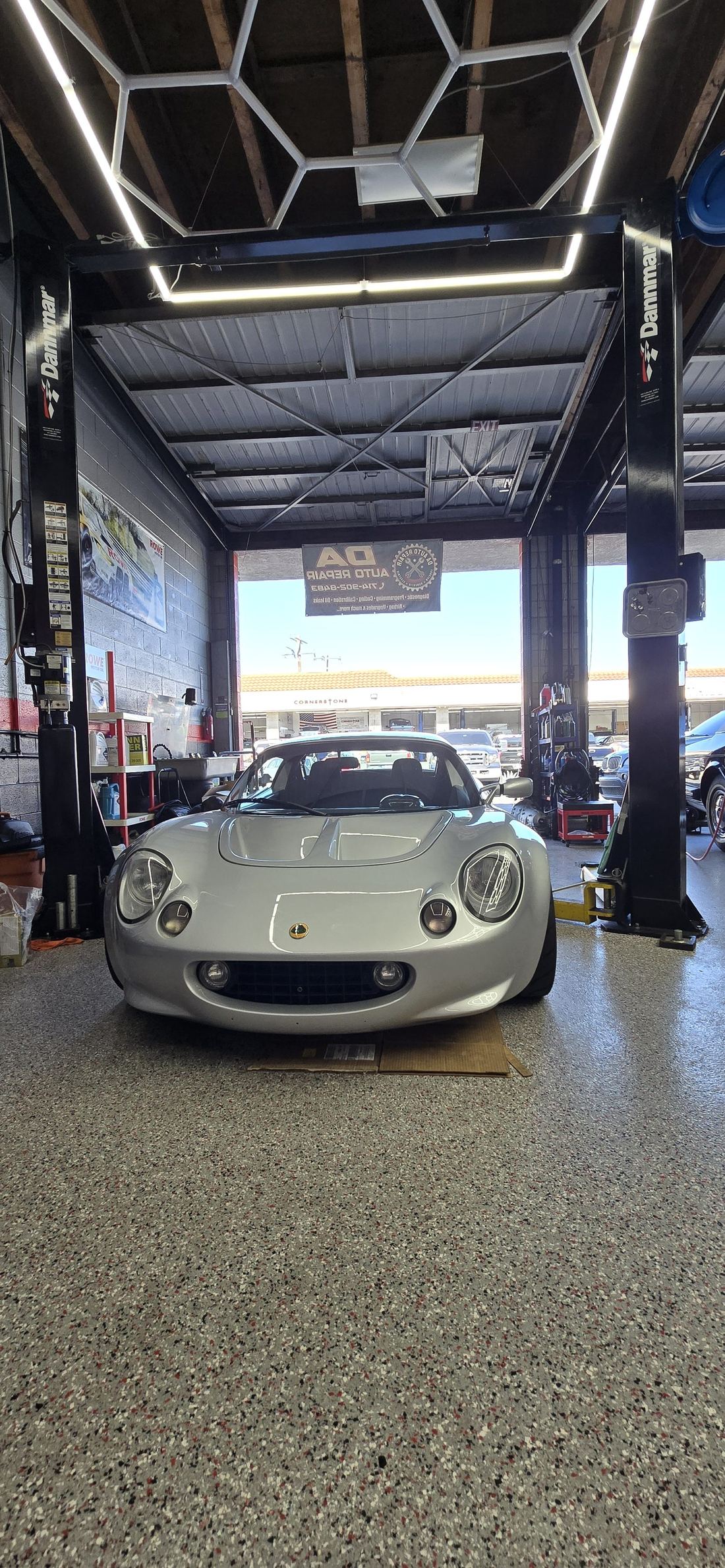 Service bay at DA Auto Repair with a Lotus Elise on the lift